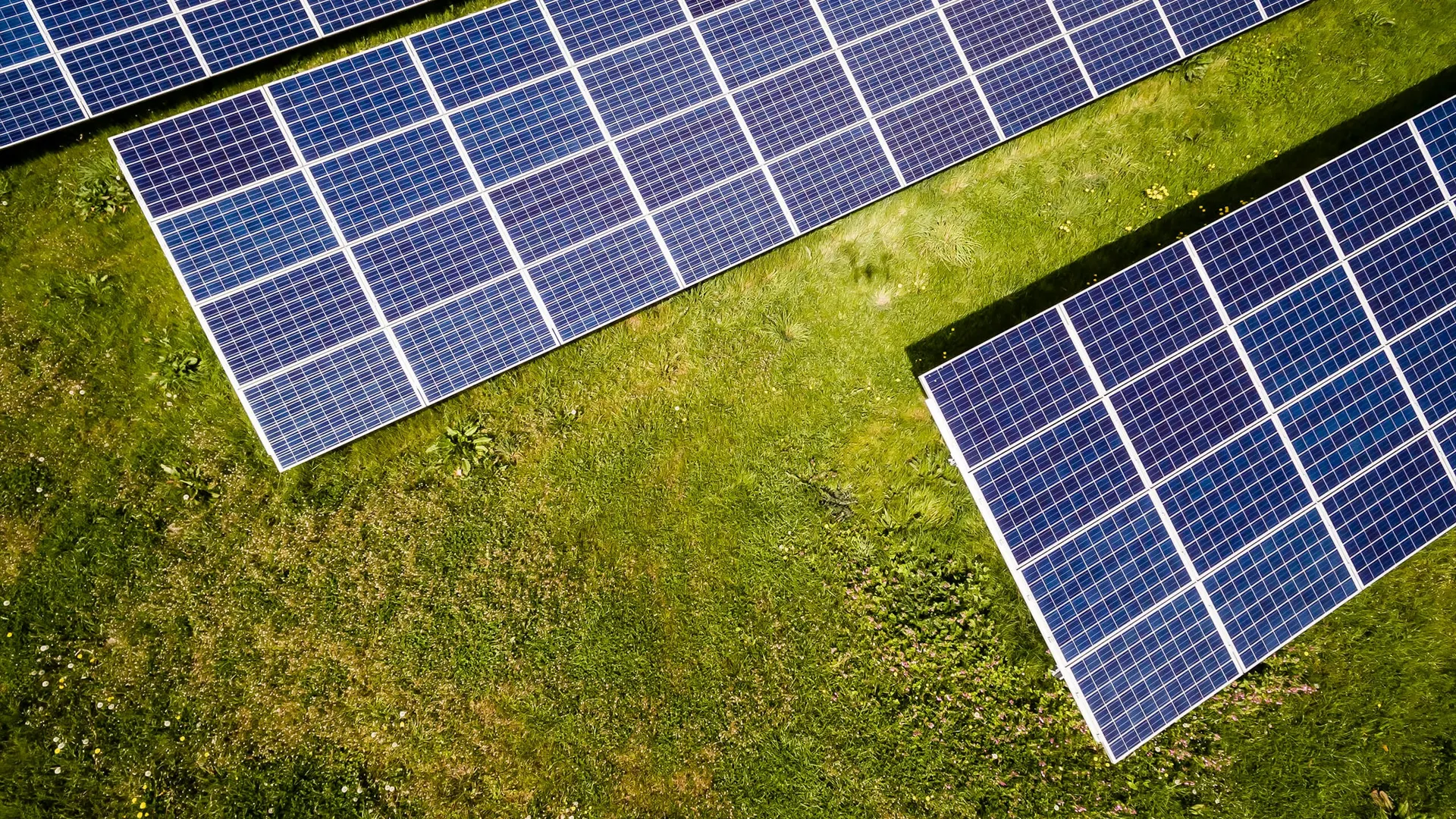 Three photovoltaic panels against the sky
